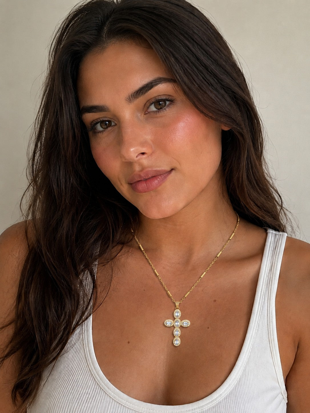 Close-up of the DUGO clear Cross Pave Zirconia Necklace worn on the neck