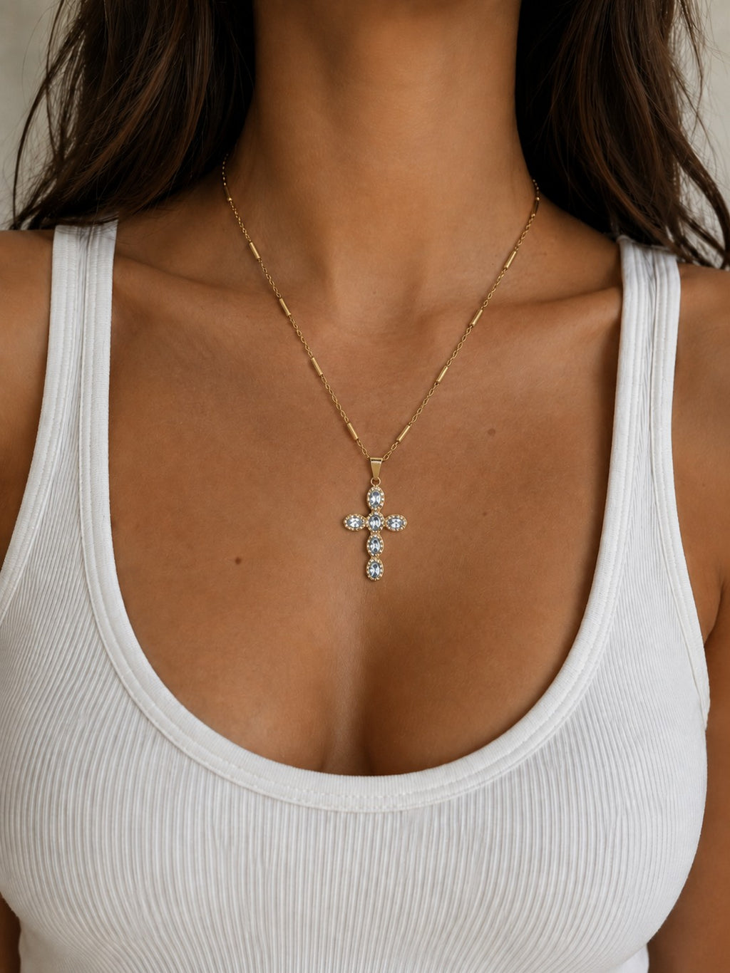 Woman wearing the DUGO clear Cross Pave Zirconia Necklace