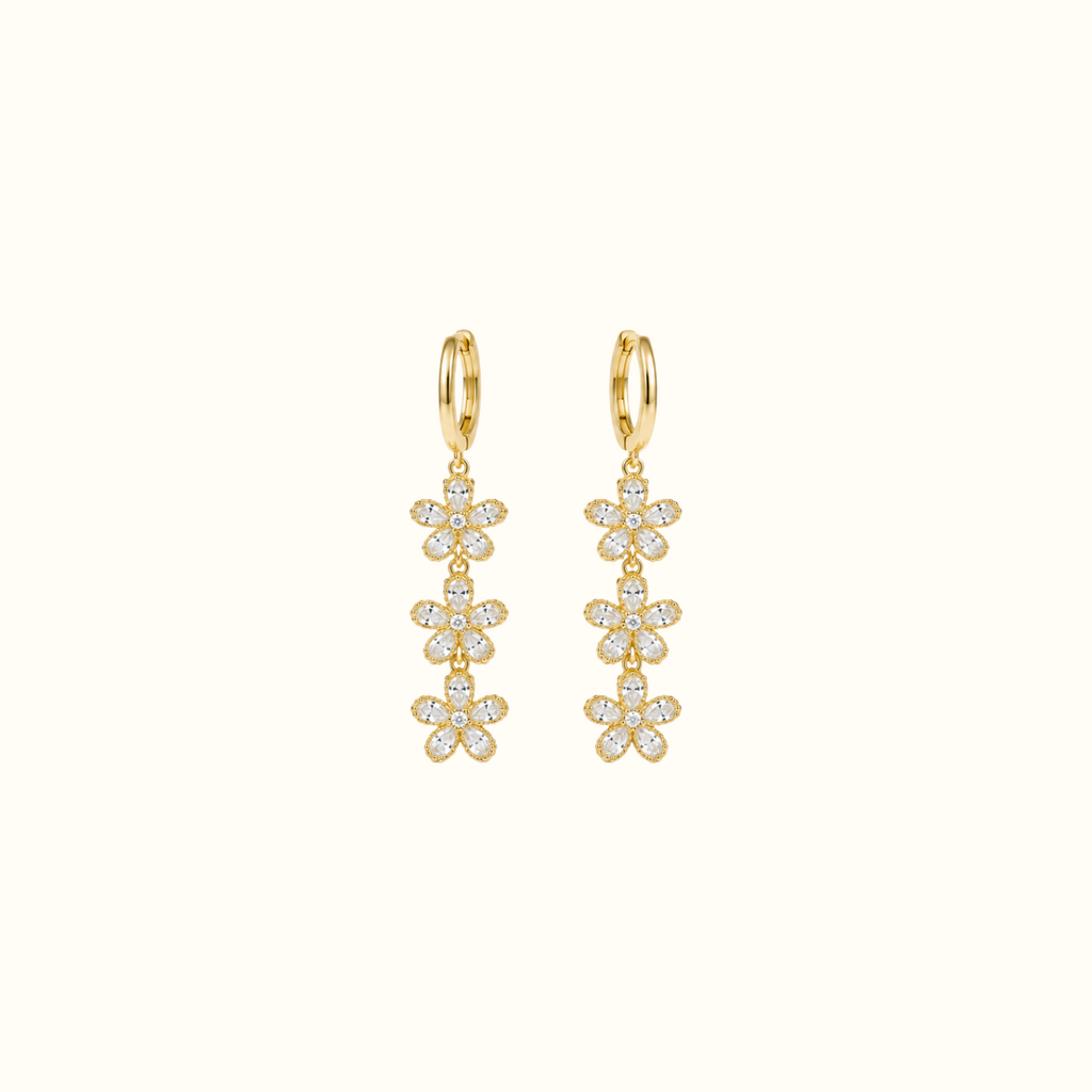 DUGO gold triple crystal flower drop earrings featuring cascading floral charms on sleek hoops for elegant style.