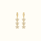 DUGO gold triple crystal flower drop earrings featuring cascading floral charms on sleek hoops for elegant style.