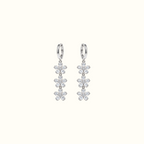 DUGO silver triple crystal flower drop earrings featuring cascading floral charms on sleek hoops.