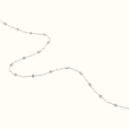 DUGO dainty enamel beaded bracelet featuring glossy white oval beads and a delicate silver chain in a minimalist style