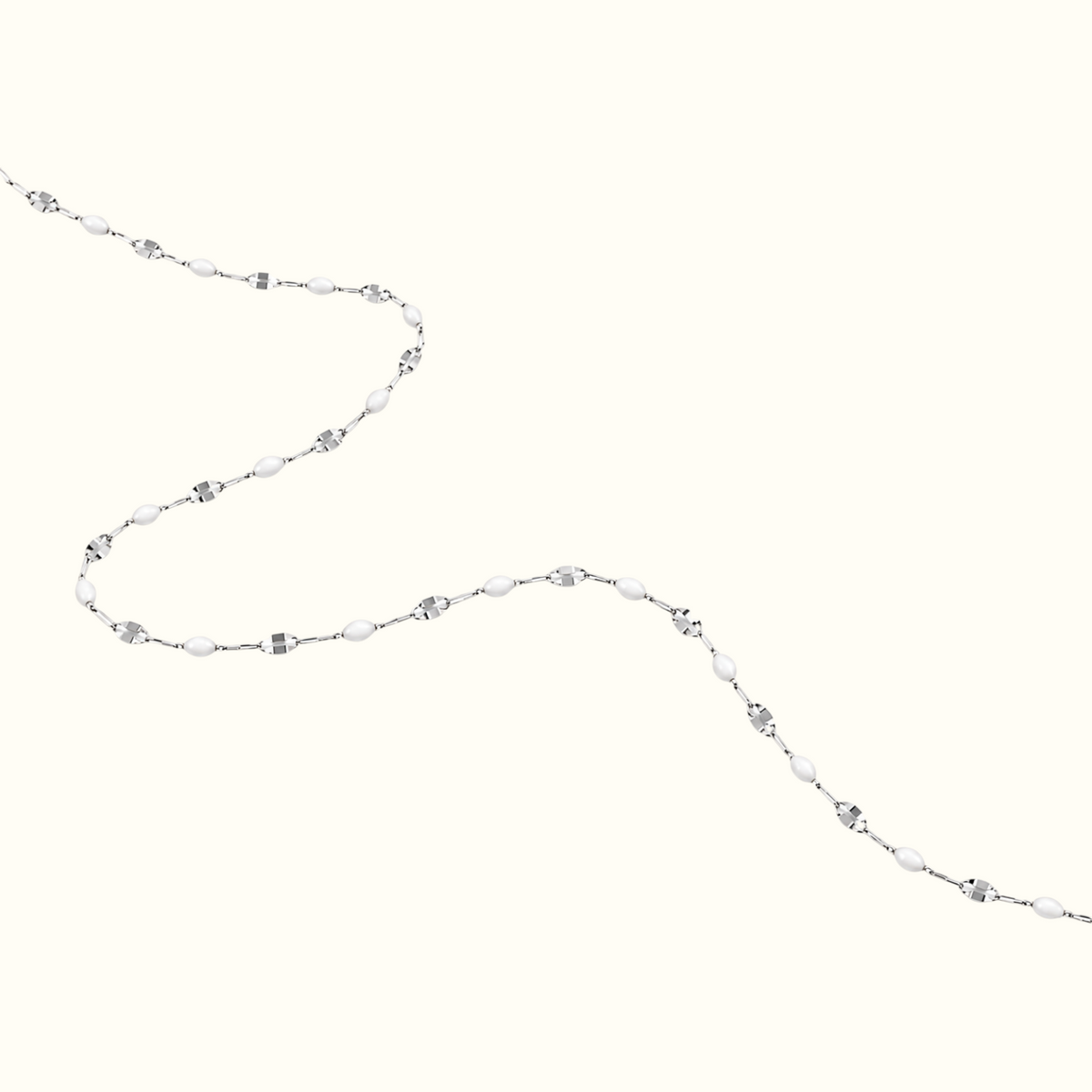 DUGO dainty enamel beaded bracelet featuring glossy white oval beads and a delicate silver chain in a minimalist style