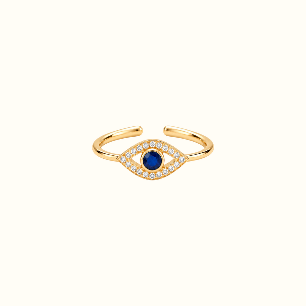 DUGO adjustable evil eye ring in 14K gold plated brass with a deep blue center stone and sparkling clear accents.
