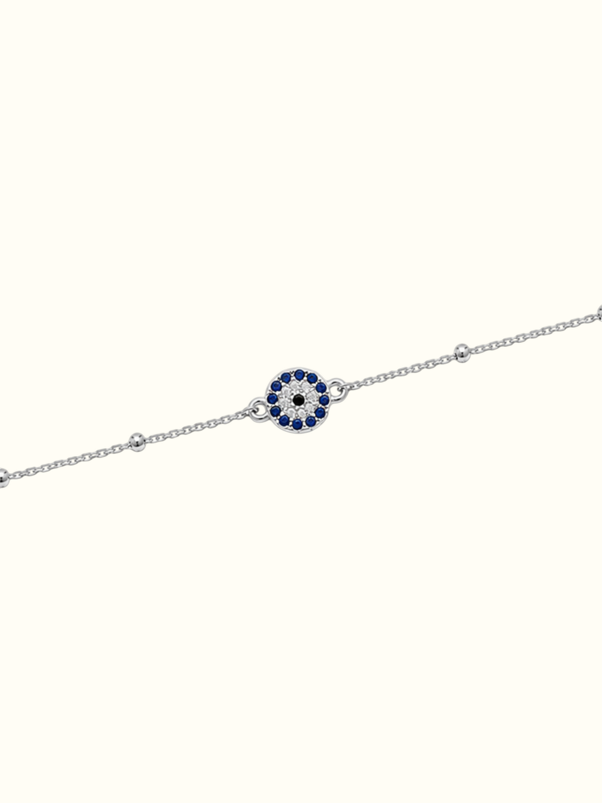 DUGO Evil Eye bracelet in silver-tone stainless steel with a blue and white crystal evil eye charm detail.
