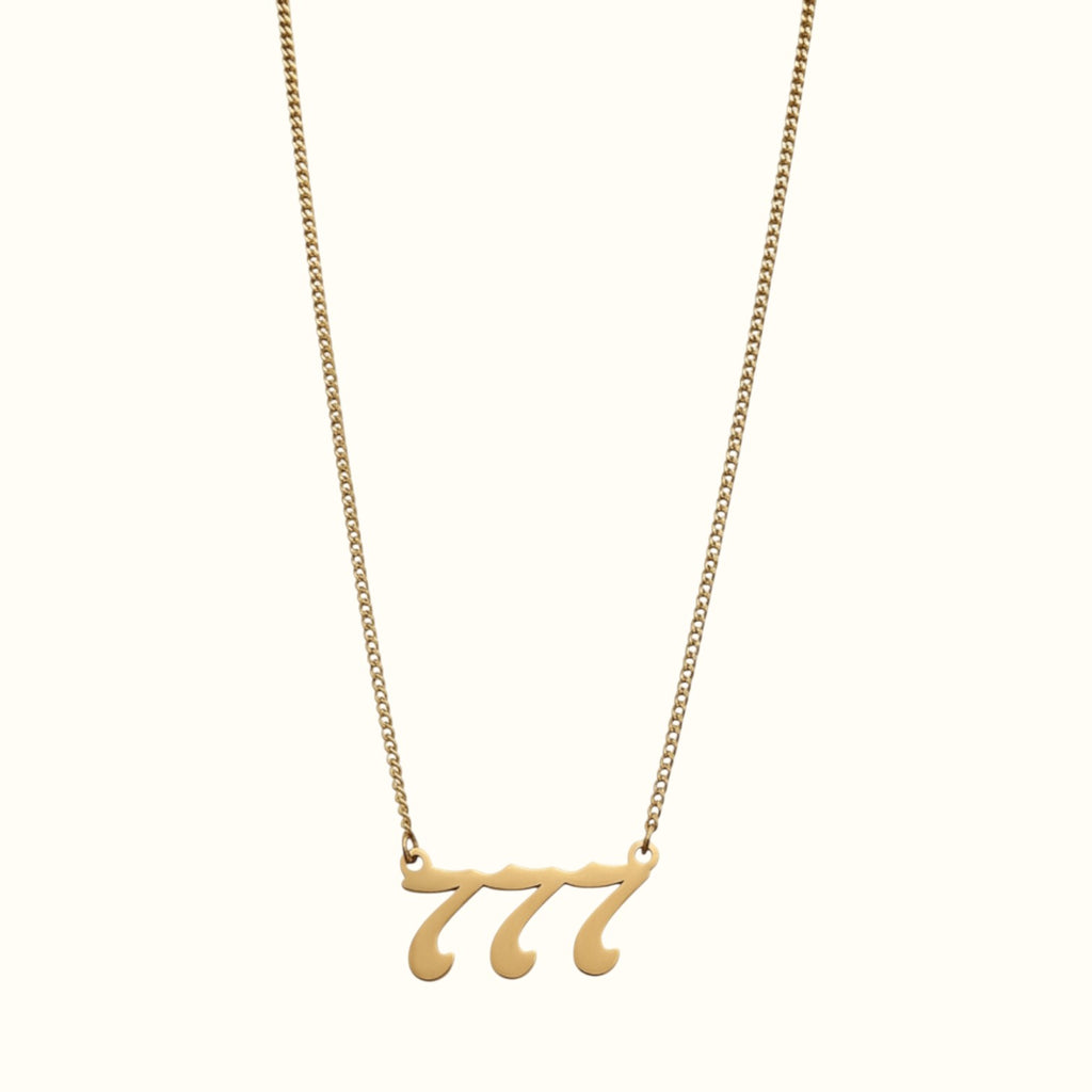 DUGO gold-toned lucky number 777 pendant necklace on a delicate curb chain