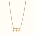 DUGO gold-toned lucky number 777 pendant necklace on a delicate curb chain