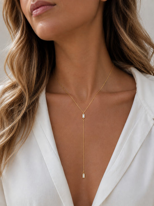 Woman wearing the DUGO gold Baguette Crystal Y Lariat Necklace