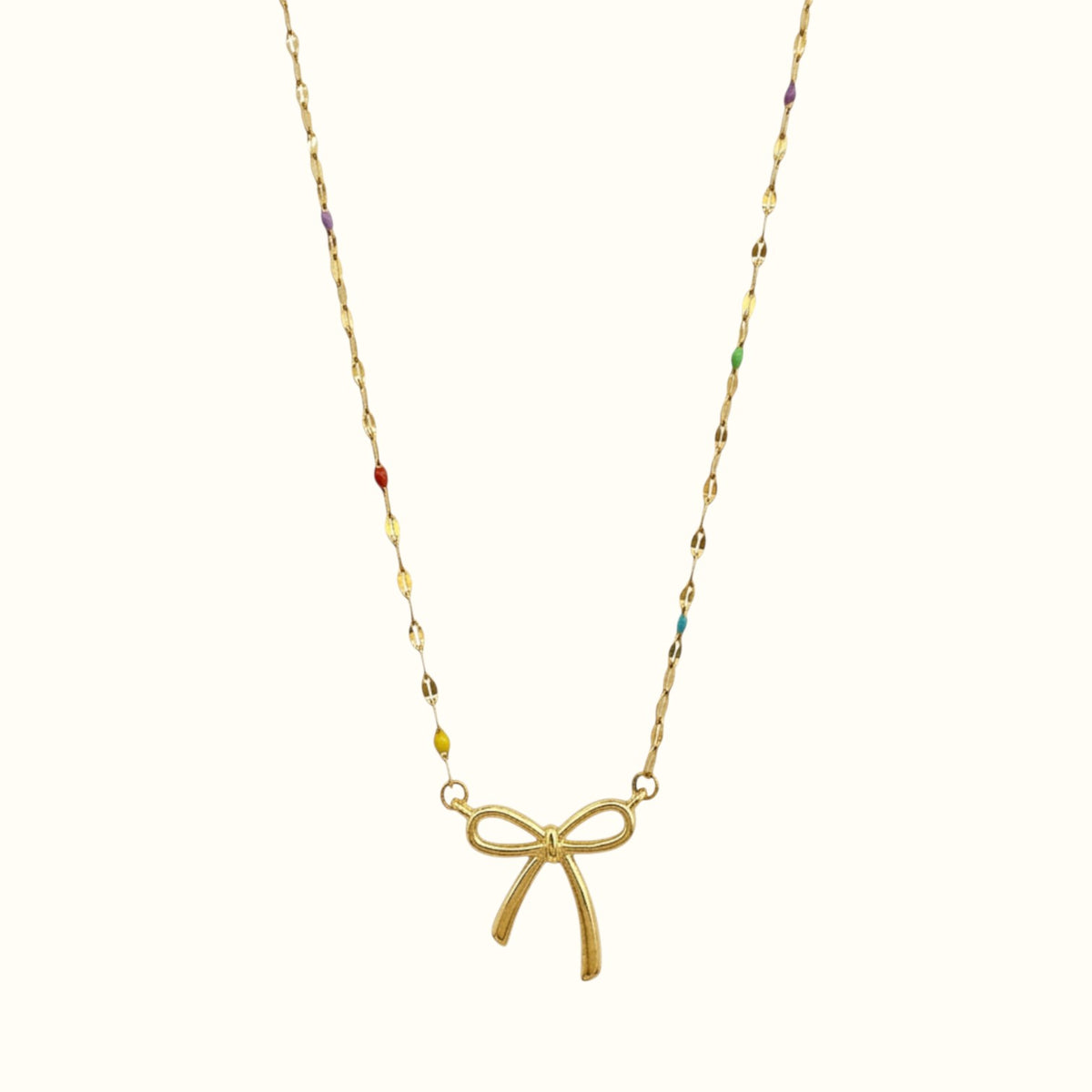 DUGO 18K gold filled necklace featuring a minimalist bow pendant and delicate chain with colorful enamel accents