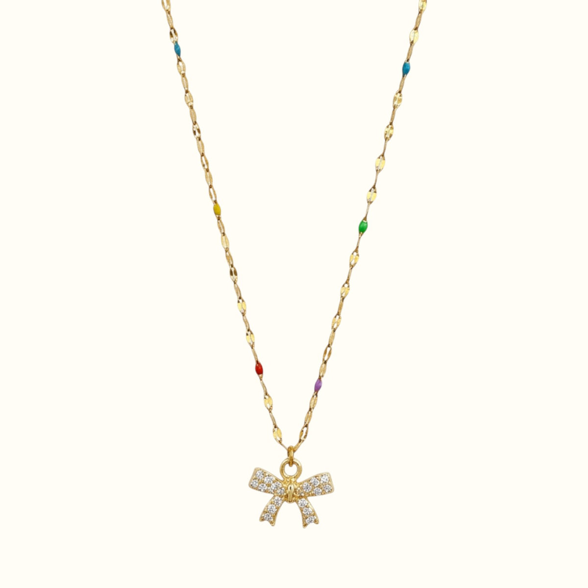 DUGO gold chain necklace featuring a mini bow pendant with sparkling zirconia stones and colorful enamel accents