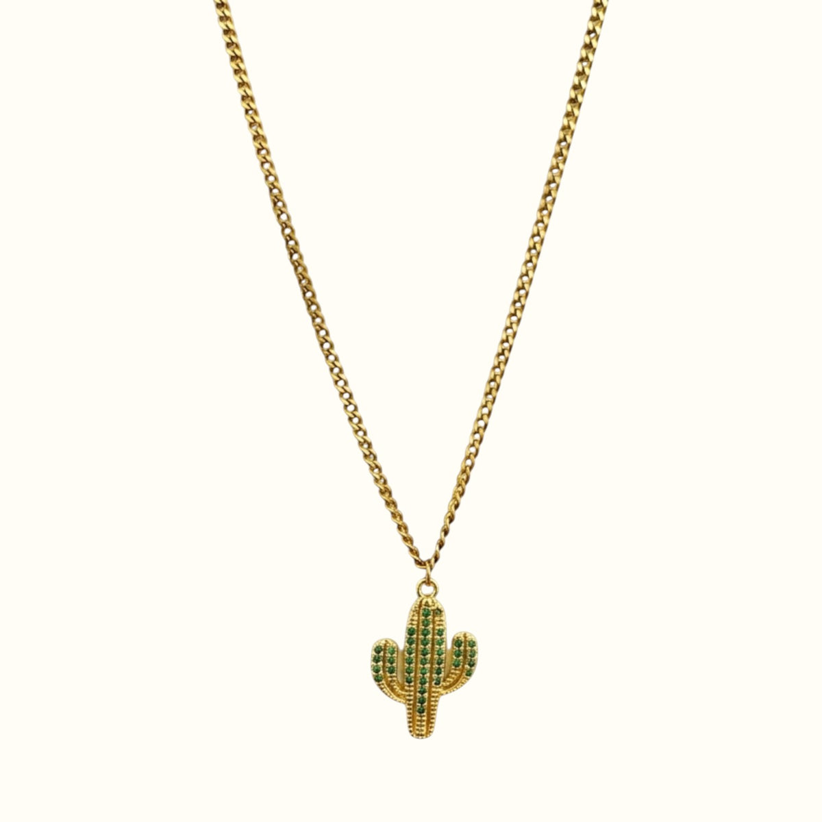 DUGO gold chain necklace featuring a small cactus pendant with green crystal accents