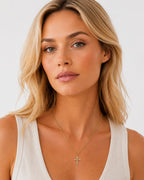 Close-up of the DUGO gold Cross Dainty Necklace worn on the neck