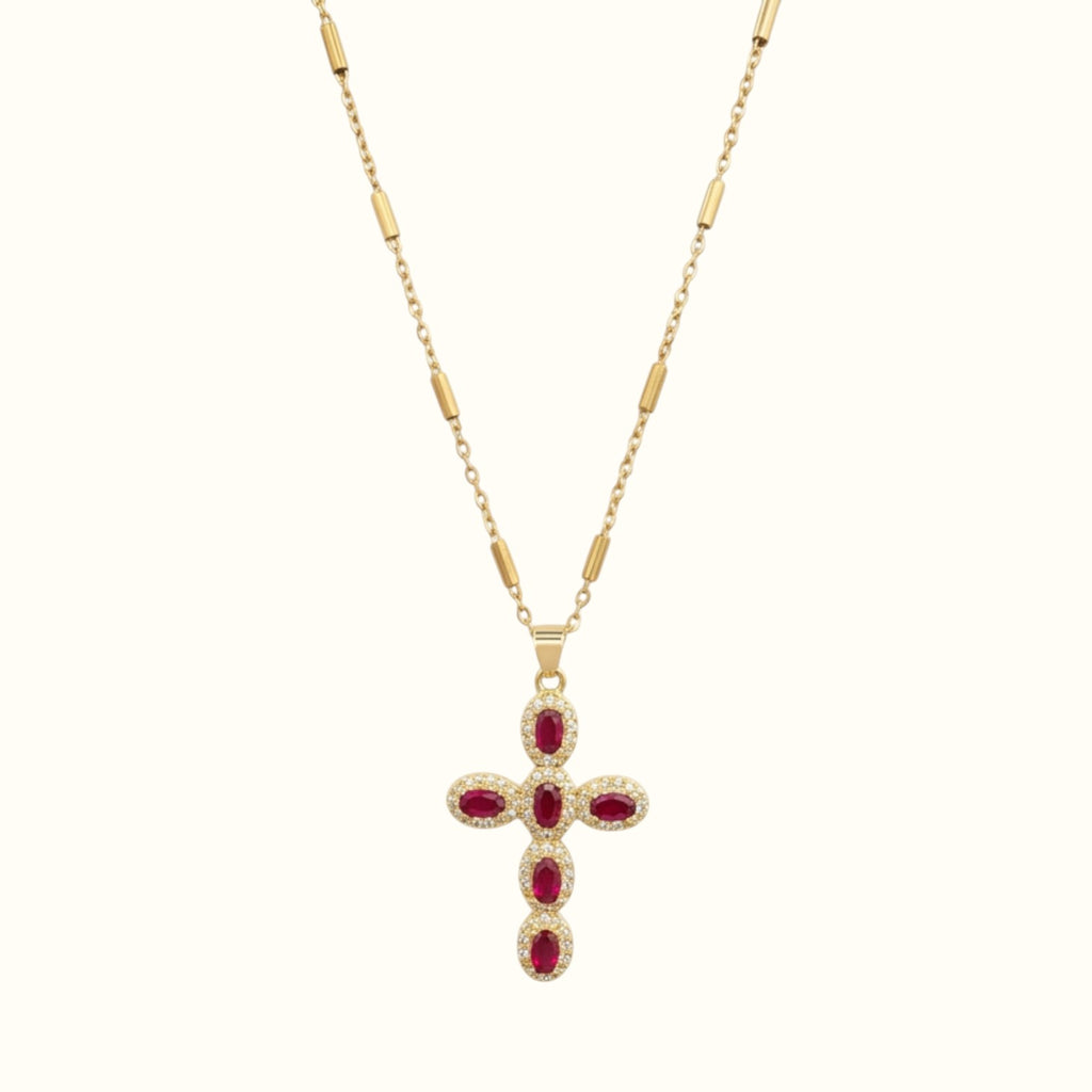 DUGO gold cross necklace featuring oval red zirconia stones and pave crystal accents on a delicate chain