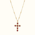 DUGO gold cross necklace featuring oval red zirconia stones and pave crystal accents on a delicate chain
