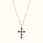 DUGO gold cross necklace featuring oval red zirconia stones and pave crystal accents on a delicate chain
