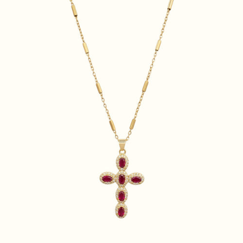 DUGO gold cross necklace featuring oval red zirconia stones and pave crystal accents on a delicate chain