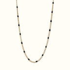 DUGO gold curb chain necklace featuring black enamel beads, crafted from 18K gold filled stainless steel.