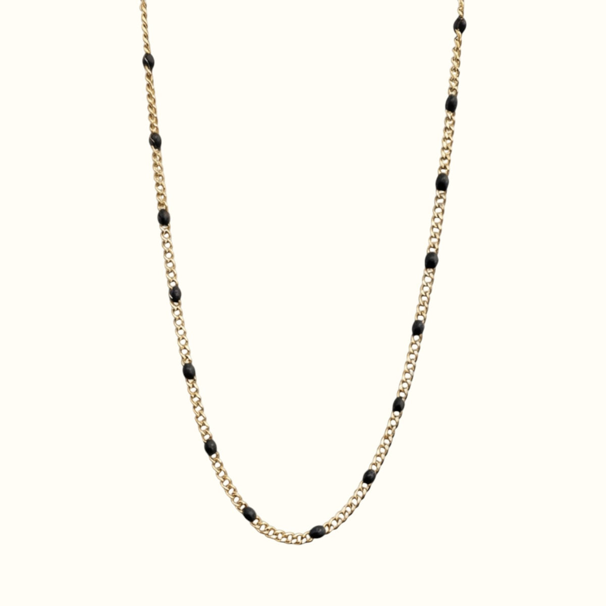DUGO gold curb chain necklace featuring black enamel beads, crafted from 18K gold filled stainless steel.