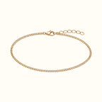 DUGO dainty gold curb chain bracelet made of waterproof stainless steel with a lobster clasp and extender chain.
