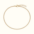 DUGO dainty gold curb chain bracelet made of waterproof stainless steel with a lobster clasp and extender chain.