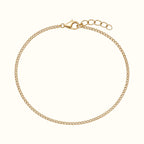 DUGO dainty gold curb chain bracelet made of waterproof stainless steel with a lobster clasp and extender chain.