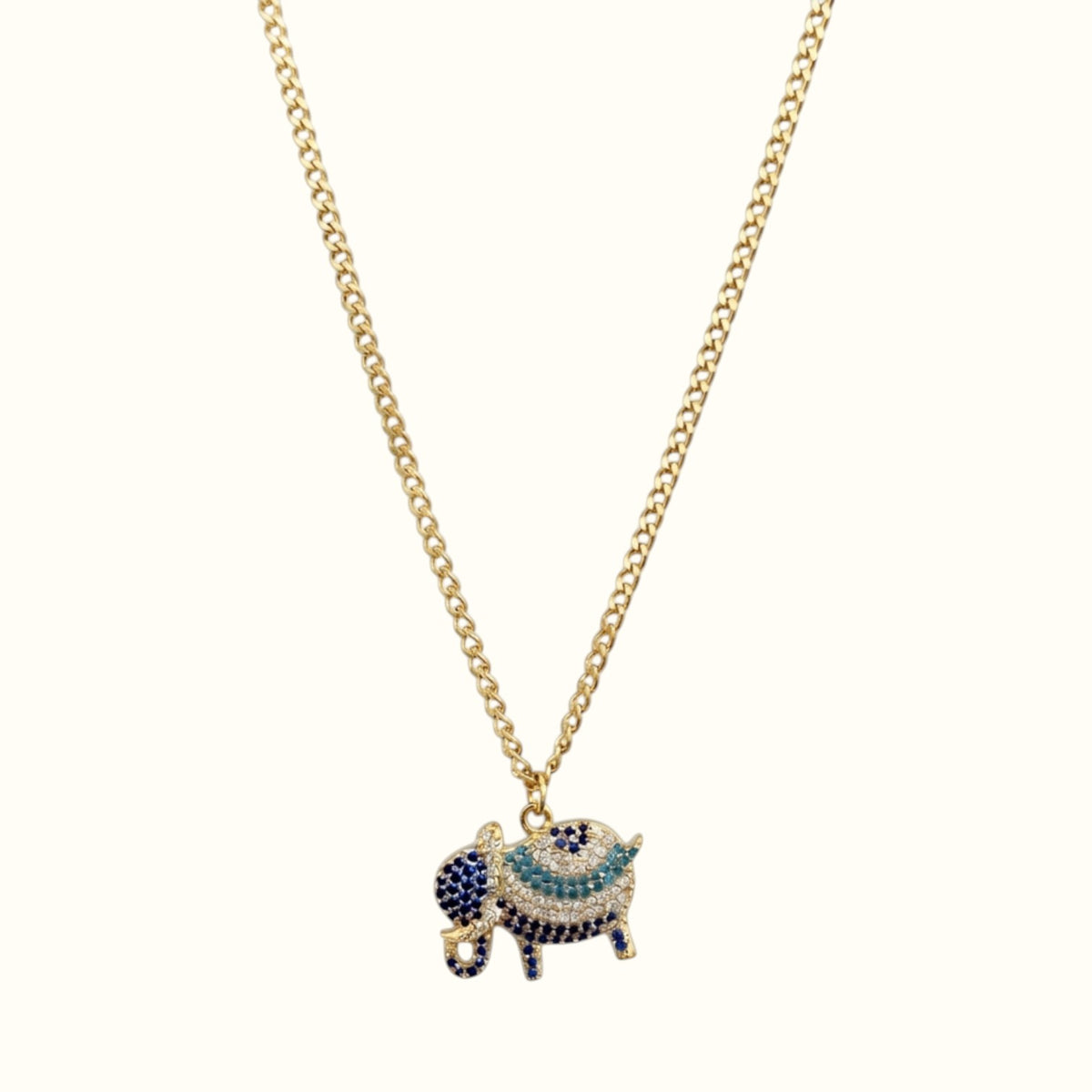 DUGO gold elephant pendant necklace featuring sparkling blue and white cubic zirconia stones on a delicate chain.