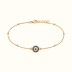 DUGO gold stainless steel evil eye bracelet with blue and white crystal detail and delicate beaded chain