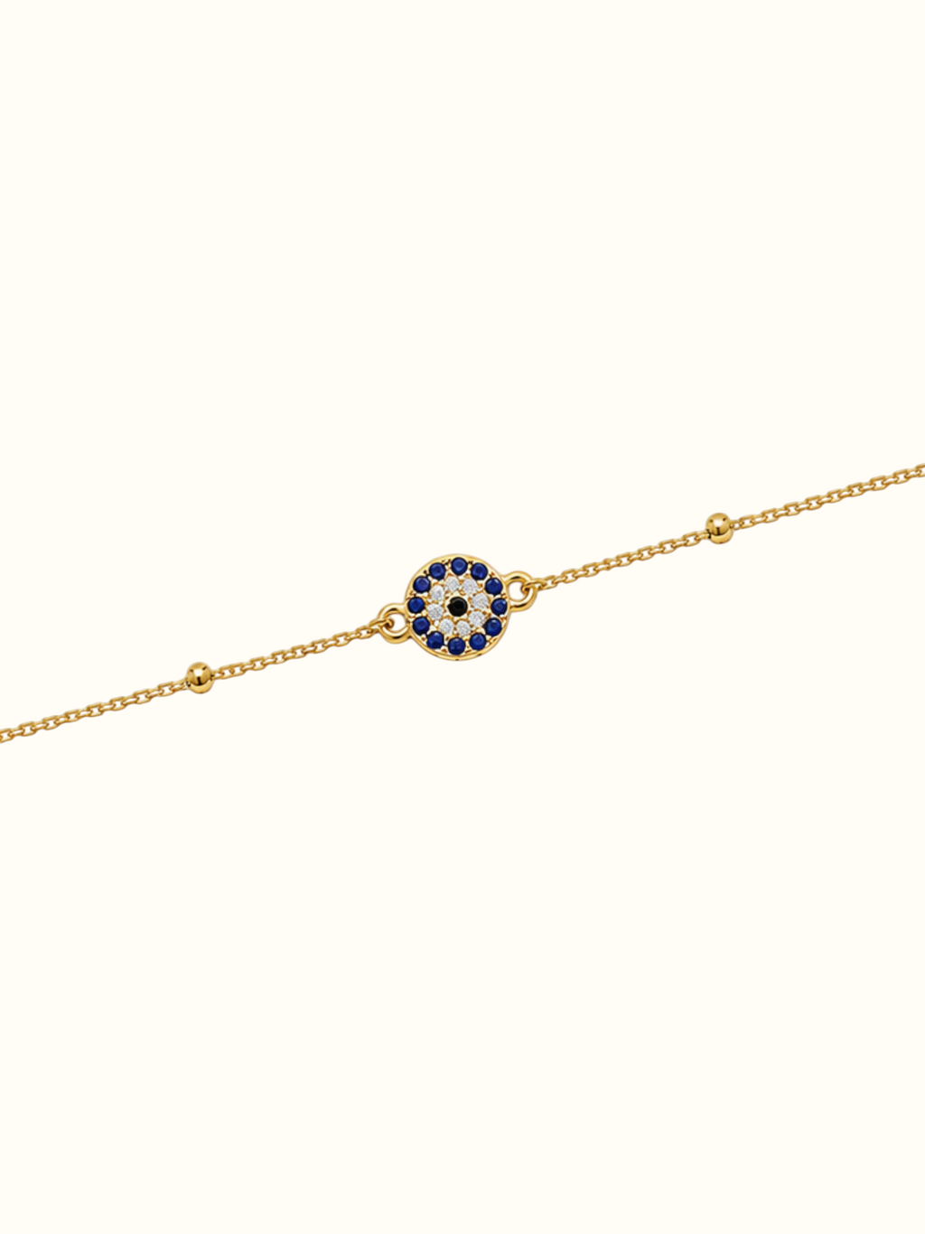 DUGO gold stainless steel evil eye bracelet with blue and white crystal accents on a delicate chain