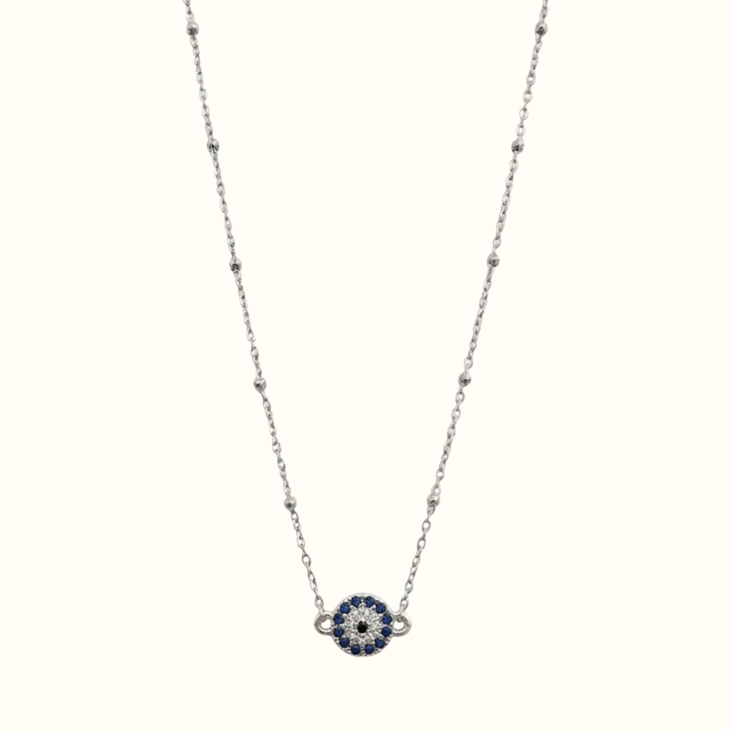 DUGO round evil eye necklace featuring blue and clear cubic zirconia stones on a delicate gold filled chain.