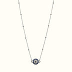 DUGO round evil eye necklace featuring blue and clear cubic zirconia stones on a delicate gold filled chain.