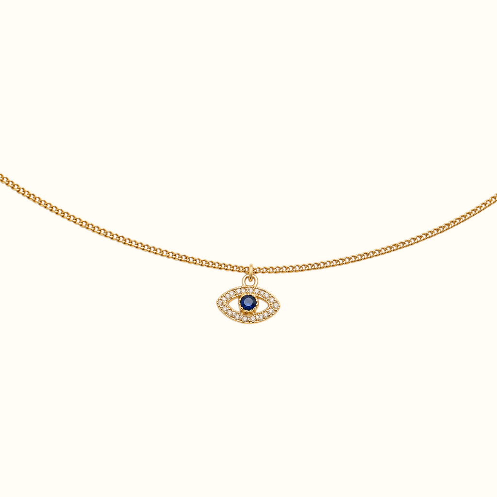 DUGO gold evil eye bracelet with a blue zirconia center and sparkling crystal halo on a delicate chain