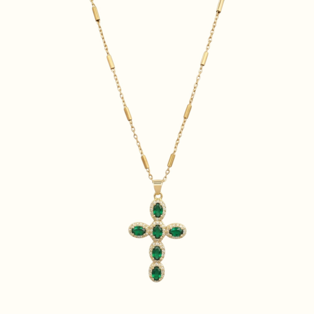 DUGO gold cross necklace featuring oval green zirconia stones surrounded by delicate pave crystals on a bar chain