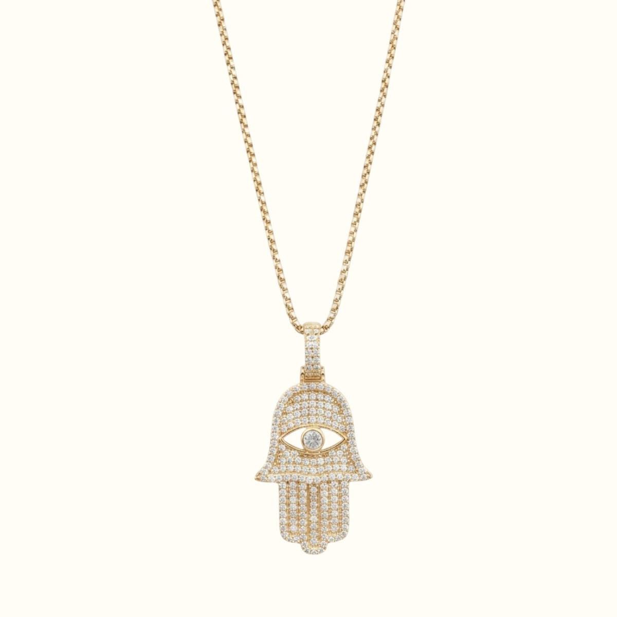 DUGO gold Hamsa hand evil eye pendant necklace featuring sparkling cubic zirconia stones on a delicate chain