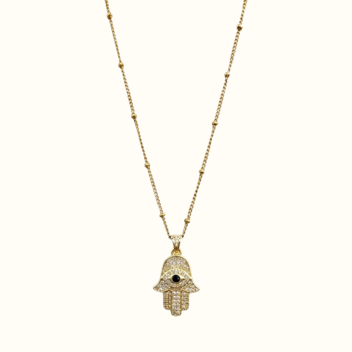 DUGO 18K gold filled Hamsa hand necklace featuring a cubic zirconia pendant with a black evil eye center