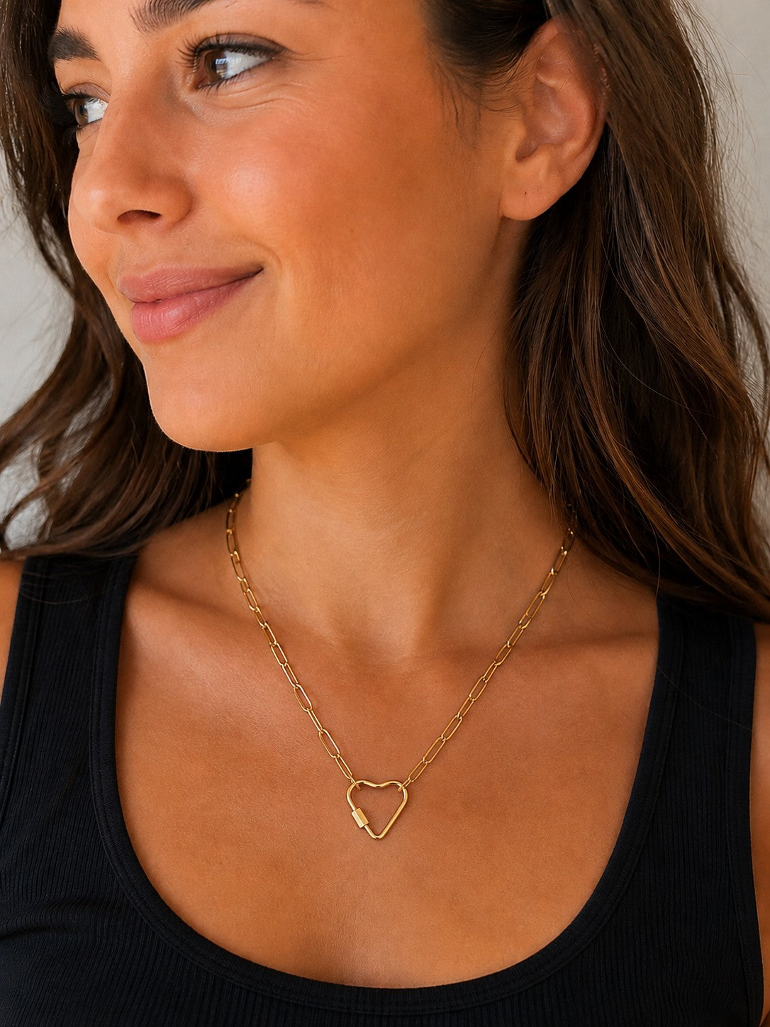 Close-up of the DUGO gold Heart Carabiner Paperclip Chain Necklace worn on the neck