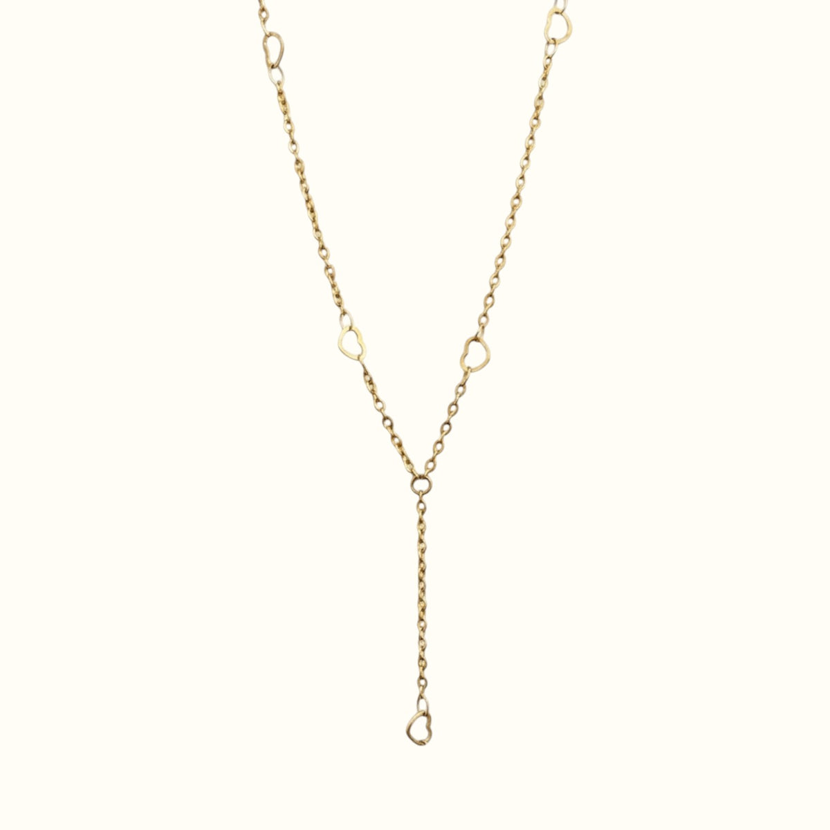 DUGO 18K gold filled lariat necklace featuring delicate heart accents on a minimalist chain for everyday wear.