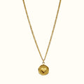 DUGO gold heart plate necklace featuring a delicate chain and a small embossed heart on a circular pendant