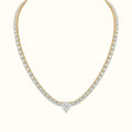 DUGO gold tennis necklace featuring a sparkling heart-shaped cubic zirconia center stone and shimmering link chain.