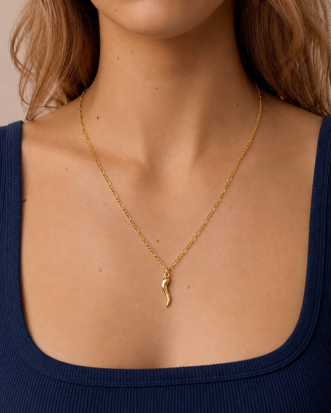 Woman wearing the DUGO gold Italian Horn Necklace