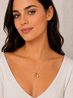 Close-up of the DUGO gold Key and Padlock Charm Necklace worn on the neck