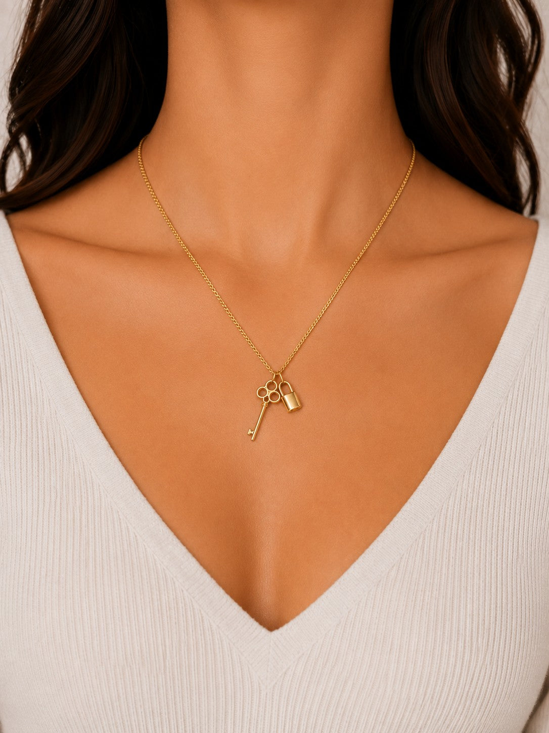 Woman wearing the DUGO gold Key and Padlock Charm Necklace