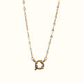 DUGO 18K gold filled stainless steel lip chain necklace featuring a round spring ring carabiner clasp centerpiece.