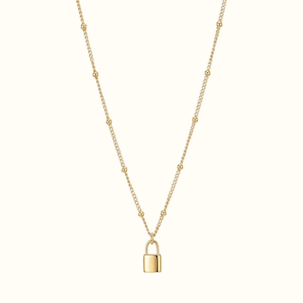 DUGO gold lock pendant necklace on a delicate beaded chain, crafted from tarnish-resistant 18K gold filled metal.