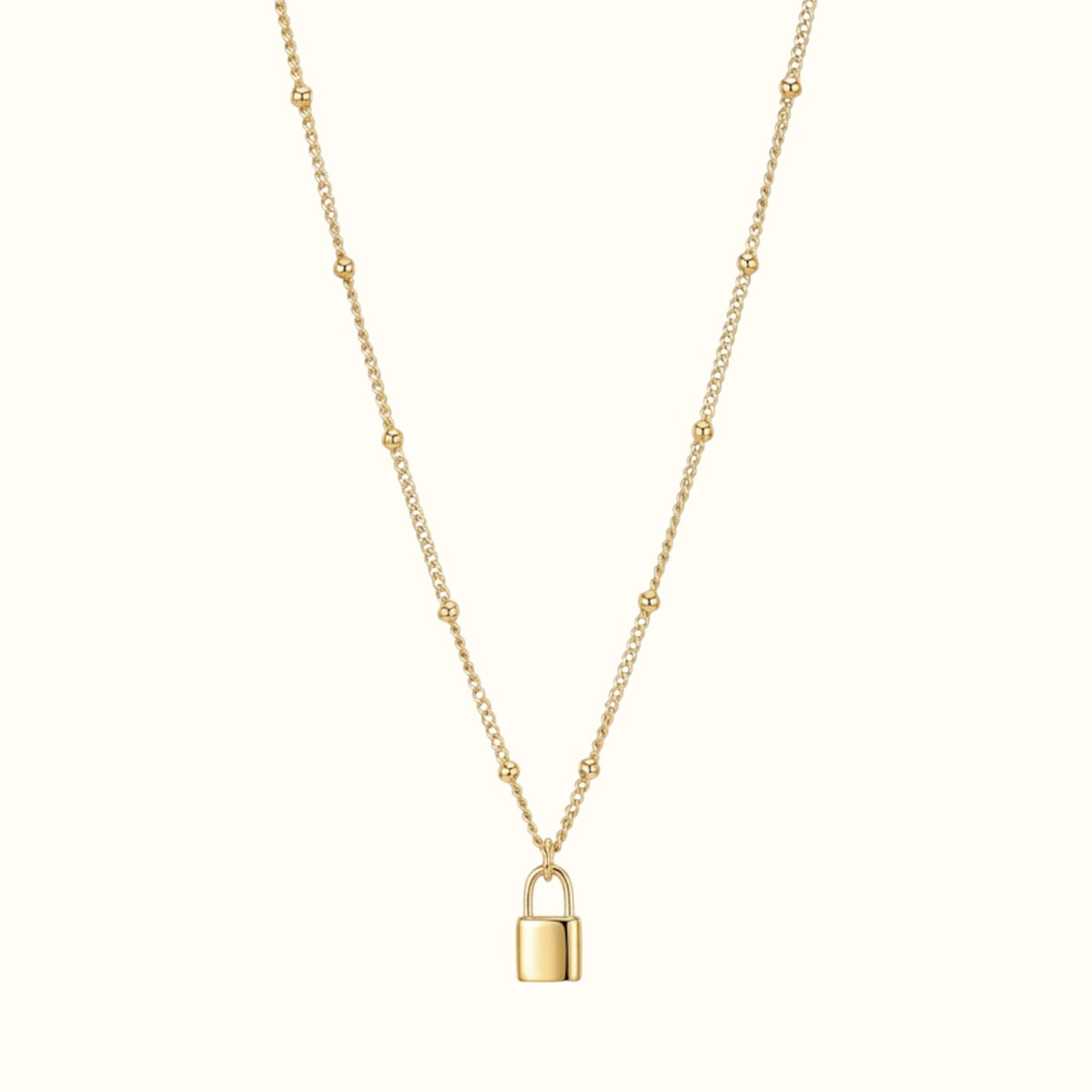 DUGO gold lock pendant necklace on a delicate beaded chain, crafted from tarnish-resistant 18K gold filled metal.