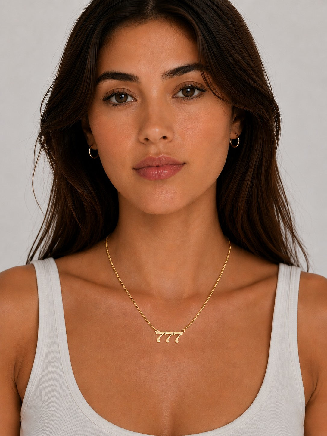 Close-up of the DUGO gold Lucky Number Necklace worn on the neck