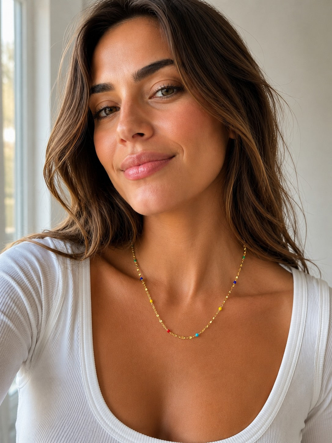 Close-up of the DUGO gold Multicolor Enamel Chain Necklace worn on the neck