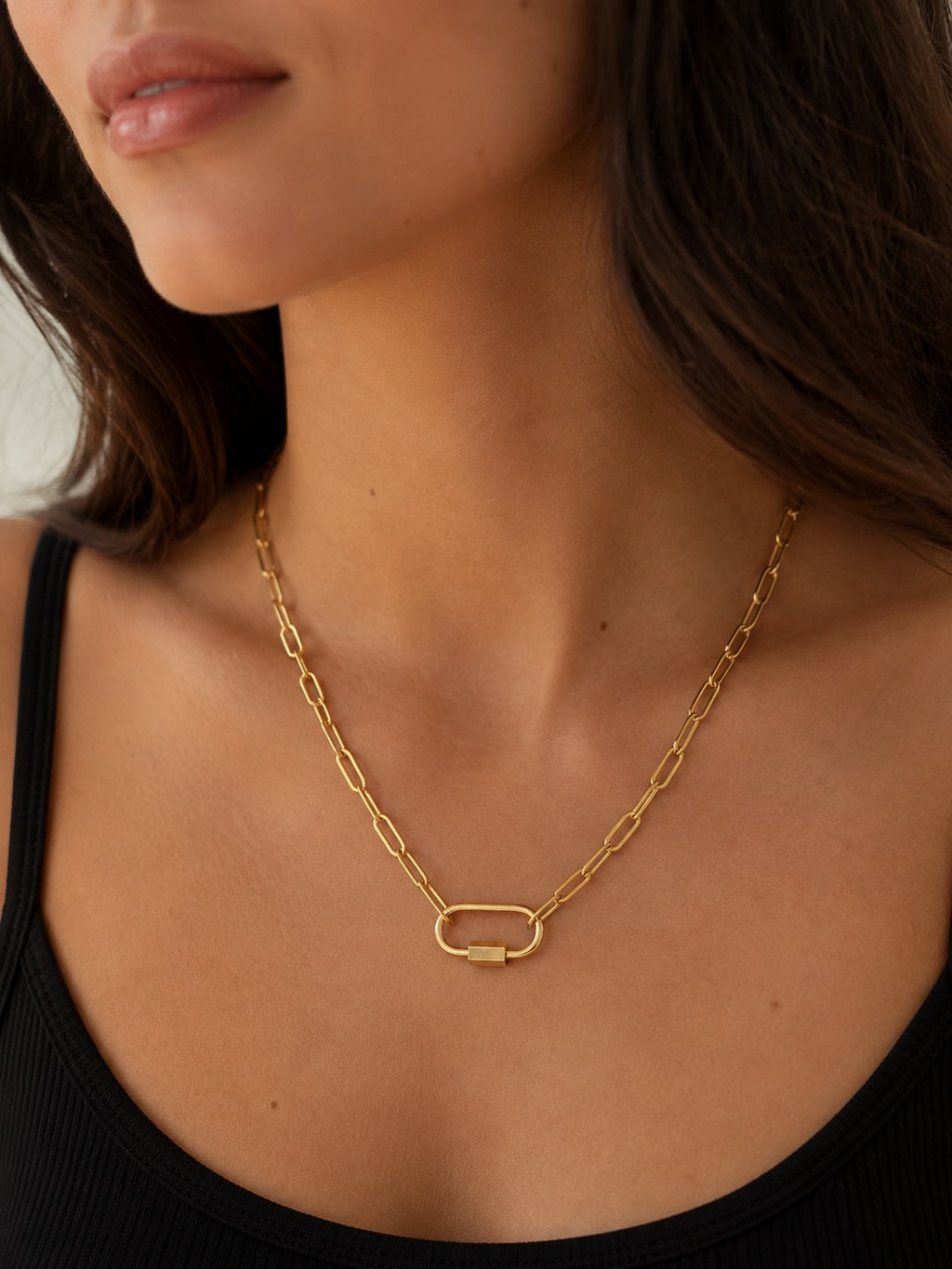 Woman wearing the DUGO gold Oval Carabiner Thick Paperclip Chain Necklace