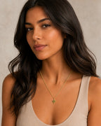Close-up of the DUGO gold Pave Cactus Pendant Necklace worn on the neck