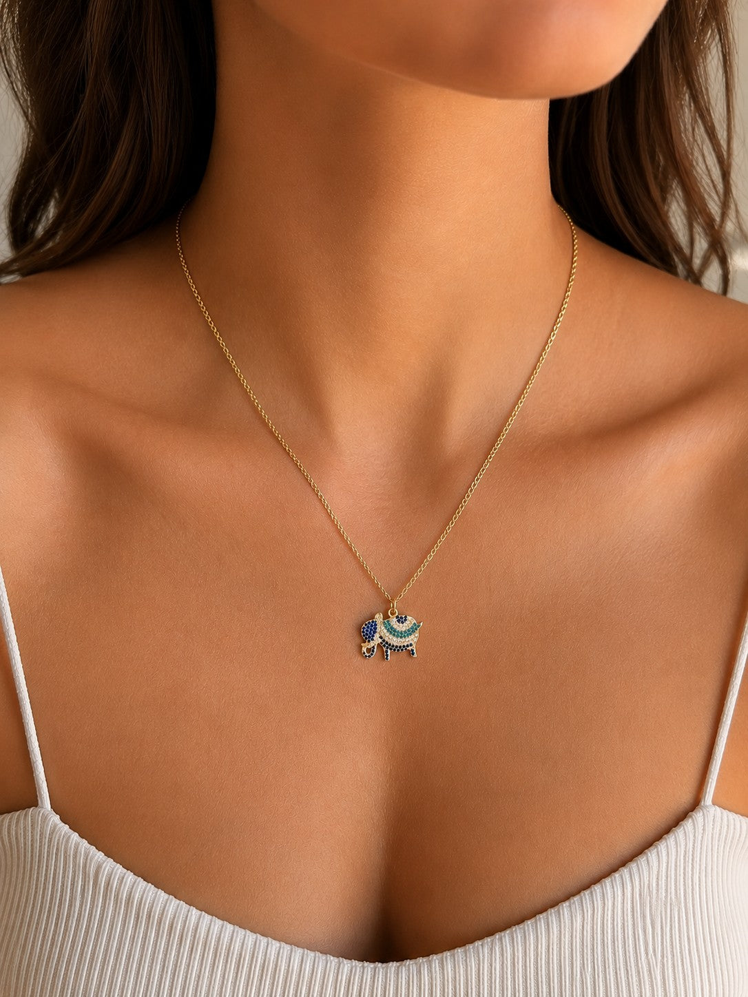 Woman wearing the DUGO gold Pave Elephant Pendant Necklace