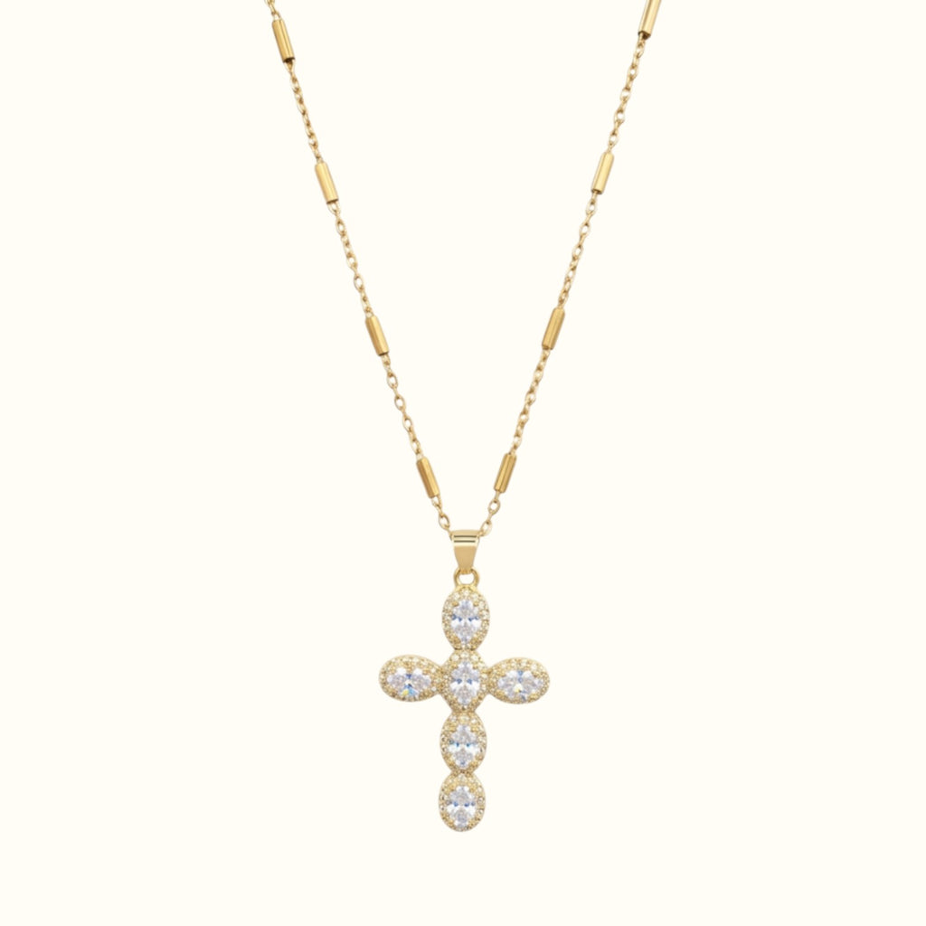 DUGO gold cross necklace featuring pave set zirconia stones on a delicate bar link chain